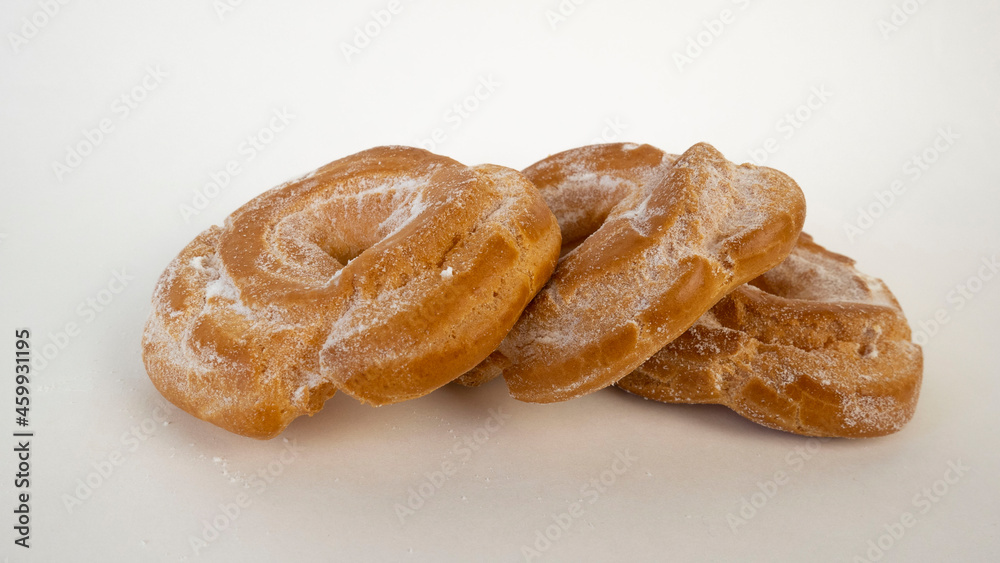 Three custard cakes close up on a white background Three custard cakes close up on a white background