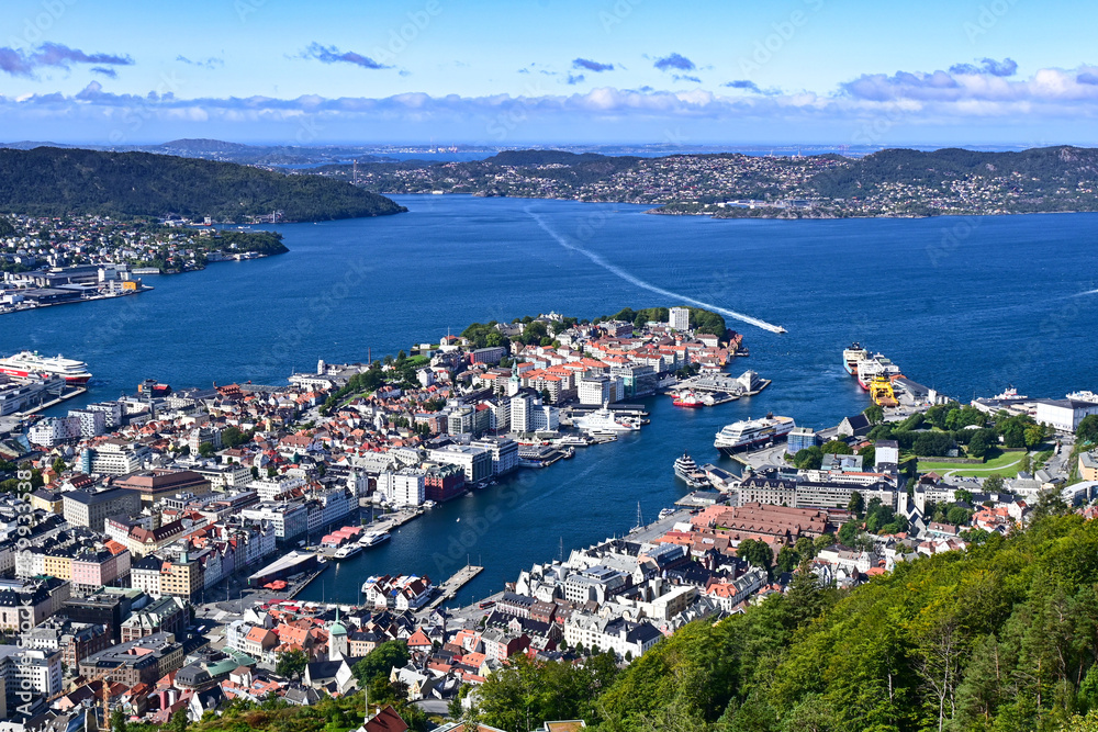 Obraz premium Aerial bird view of Bergen city and harbour with ferry entering the port