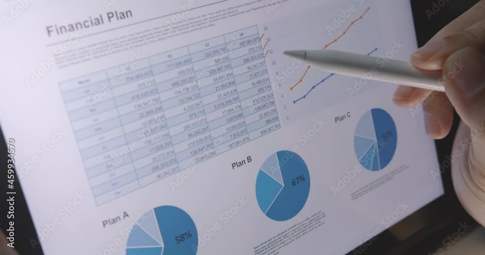 Close-up hand use pen write check growth data number on touch screen laptop note pad app. Loan agent job work at night or MBA tax study in retail graph report  review read saving plan crypto chart.