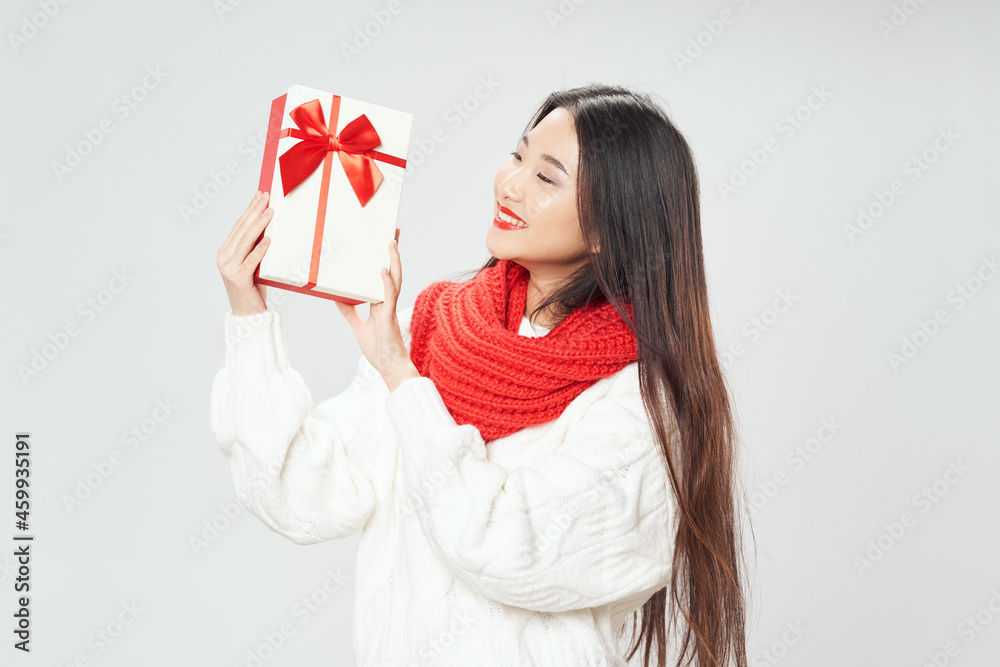 beautiful asian woman with gift box and red scarf around her neck beautiful asian woman with gift box and red scarf around her neck