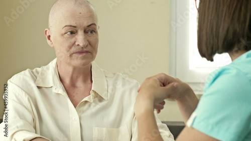 Wallpaper Mural Female oncologist is trying to cheer up an elderly woman with cancer. Life extension hope. Torontodigital.ca