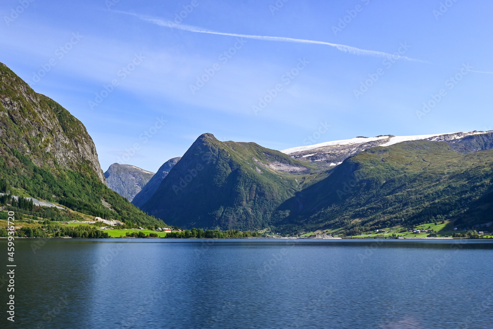 Norwegian fjord with mountains with snowy tops in Scandinavia