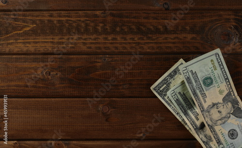 Concept dollars on wooden planks  table texture  top view 
