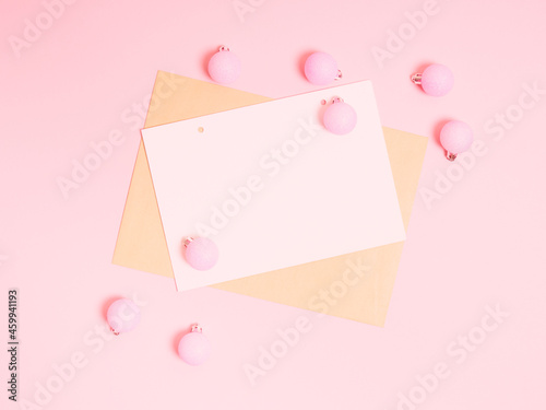 Top view of Christmas composition on pastel pink background. Holiday greeting card with copy space to text. © Kulbabka