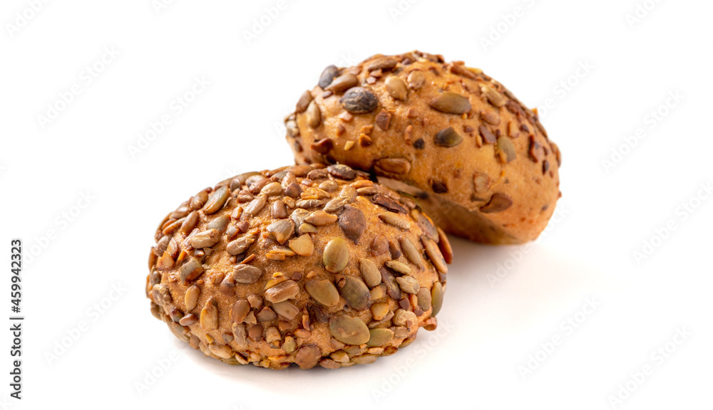 Round rye bread with seeds isolated on white background. Rye buns with sunflower and pumpkin seeds. Round rye bread with seeds isolated on white background. Rye buns with sunflower and pumpkin seeds.