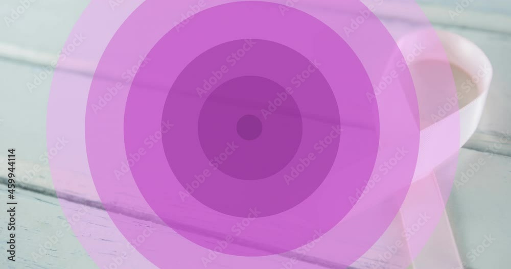 Animation of purple circles and hope with pink ribbon over ribbon on white wooden background Animation of purple circles and hope with pink ribbon over ribbon on white wooden background