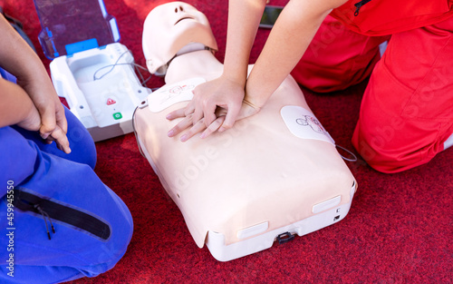 First aid and CPR class using automated external defibrillator device - AED photo