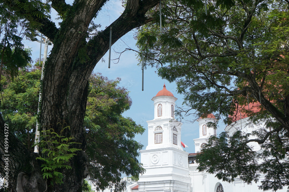 The tower of Blenduk Church are framing from a banyan tree in a nearby park. The tower of Blenduk Church are framing from a banyan tree in a nearby park.
