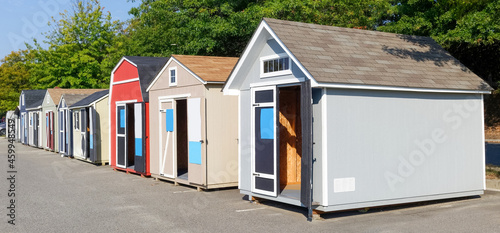 Row of demo garden sheds for sale. photo