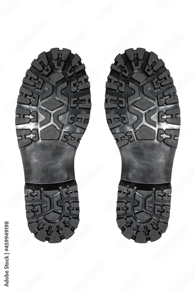 Rubber soles of military boots with tread on a white background.Studded sole of military boots top view. Rubber soles of military boots with tread on a white background.Studded sole of military boots top view.