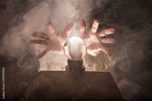 Fotografija A fortune teller's hands conjure up a crystal ball