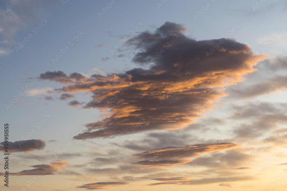 scenic orange and gray clouds at sunset abstract sky background