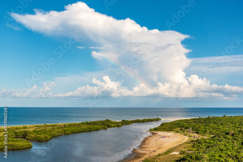 Clouds and a rainbow above Tigertail lagoon on Marco Island, Florida