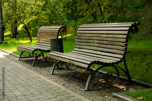 Empty wooden benches in city park