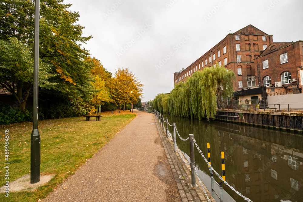 Norwich, Norfolk, UK – September 11 2021. Riverside footpath along the River Wensum opposite St James housing development