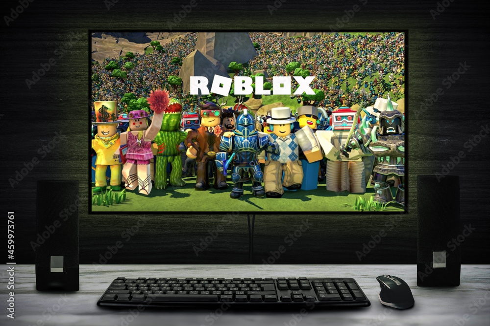 Cali, Colombia - August 15, 2021: Roblox logo on PC screen with keyboard,  mouse and speakers. Roblox is an online game platform and game creation  system. Stock Photo