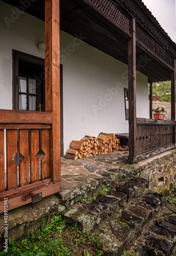 Stacked firewood near the w...