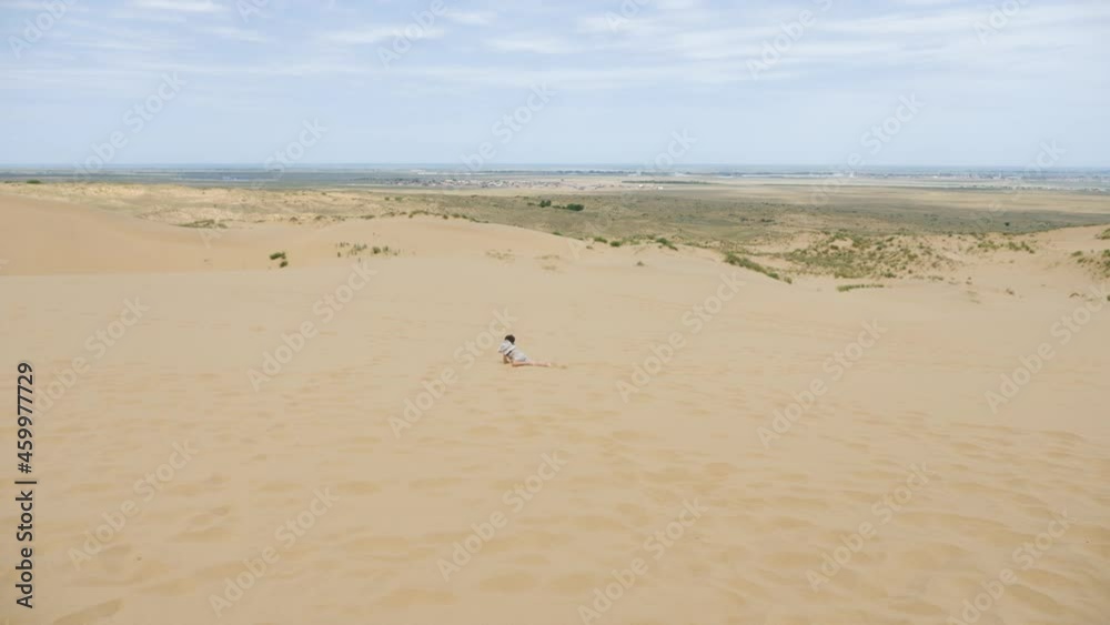 boy child runs in the clothes of a traveler with a hat runs barefoot through boy child runs in the clothes of a traveler with a hat runs barefoot through