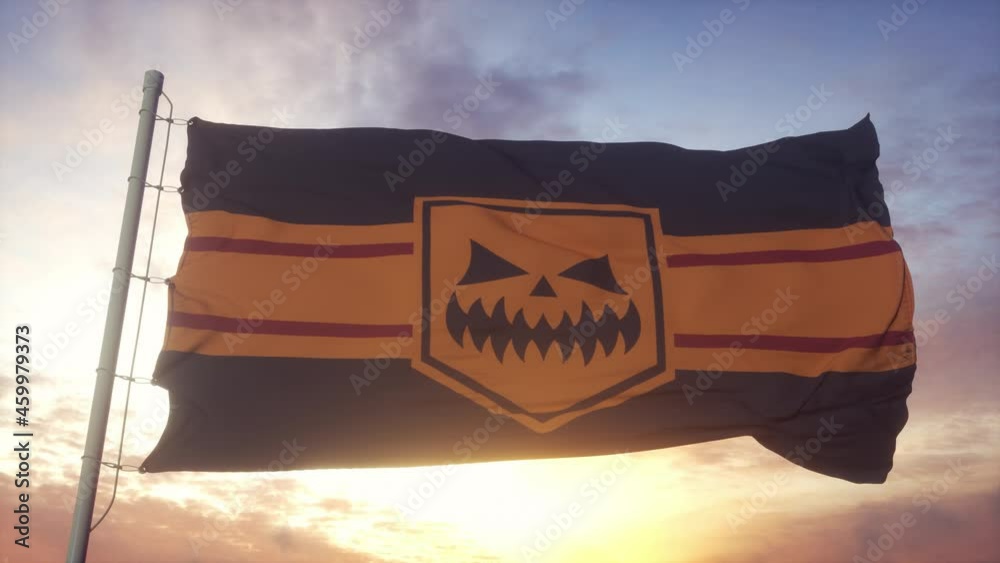 Halloween flag waving in the wind, sky and sun background Halloween flag waving in the wind, sky and sun background