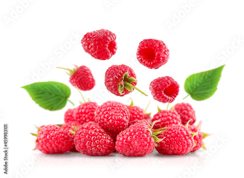 fresh raspberries. flying berries. isolation on white background with reflection 