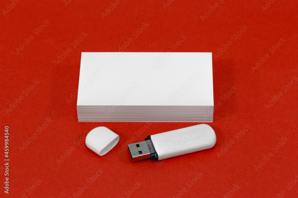 usb flash drive and business card on red mockup usb flash drive and business card on red mockup