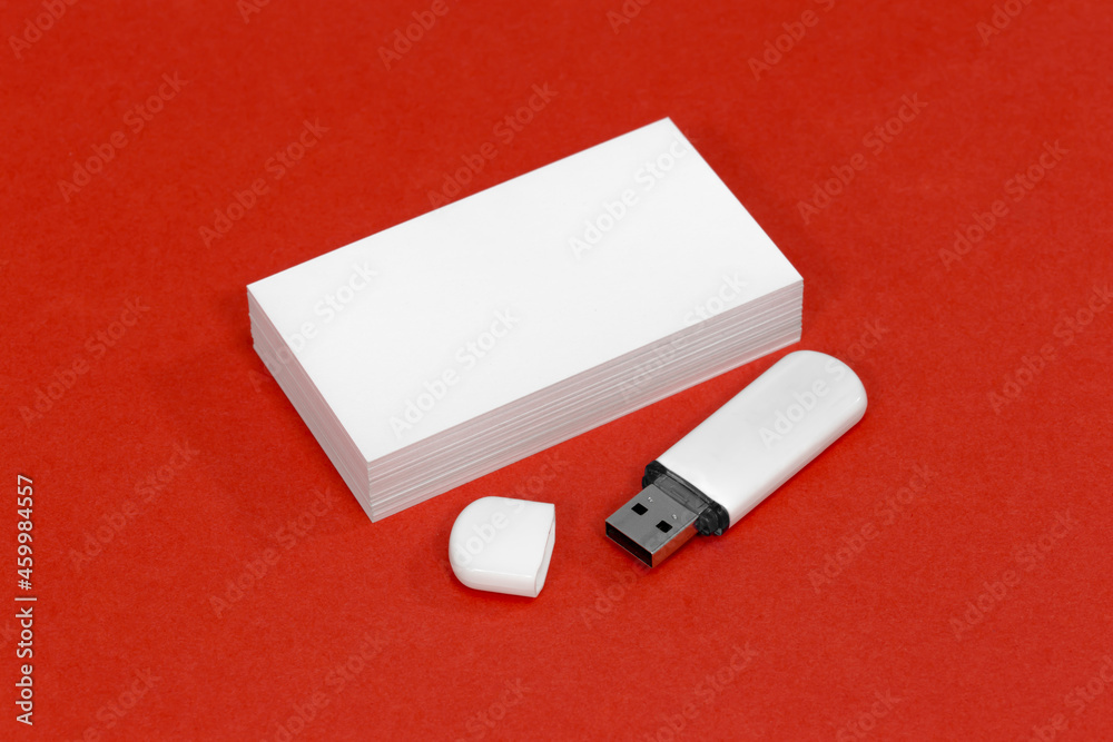 usb flash drive and business card on red mockup usb flash drive and business card on red mockup