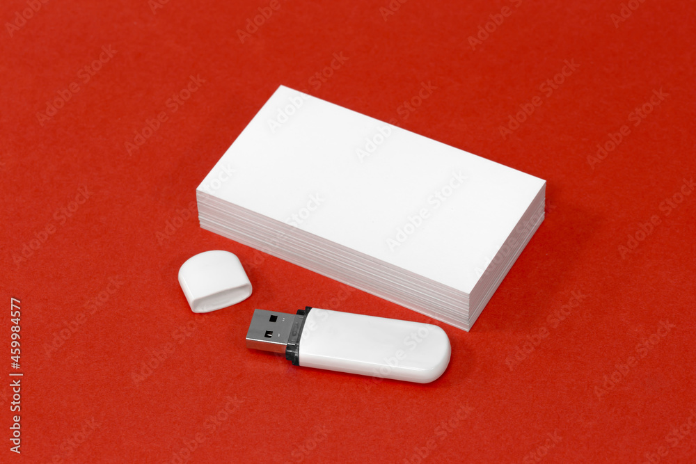 usb flash drive and business card on red mockup usb flash drive and business card on red mockup