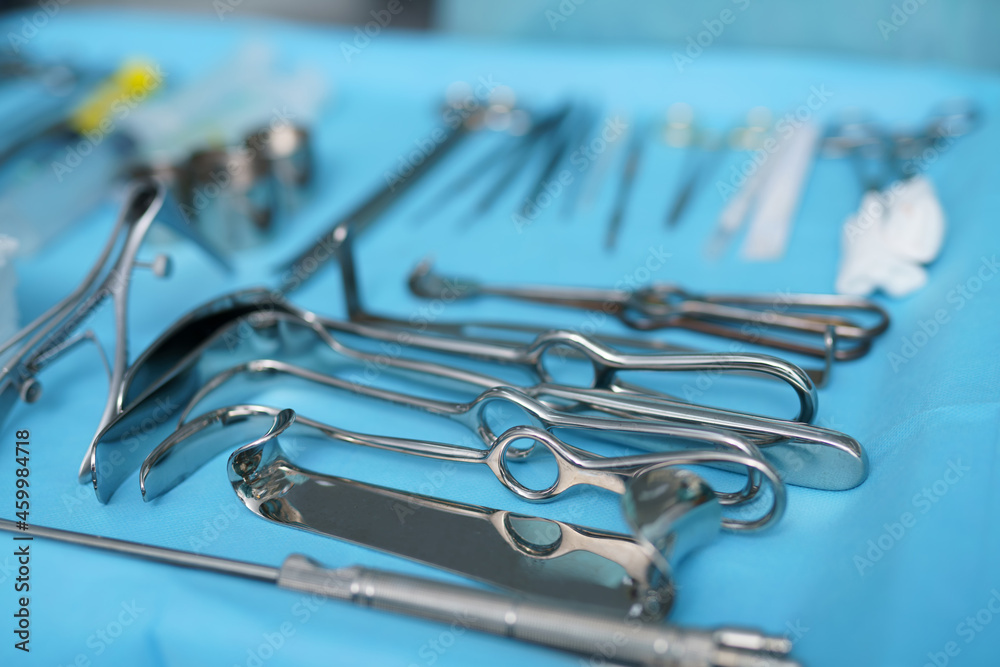 Instrumental surgical In operating room. Surgical instruments on the sterile table. Cropped view Instrumental surgical In operating room. Surgical instruments on the sterile table. Cropped view