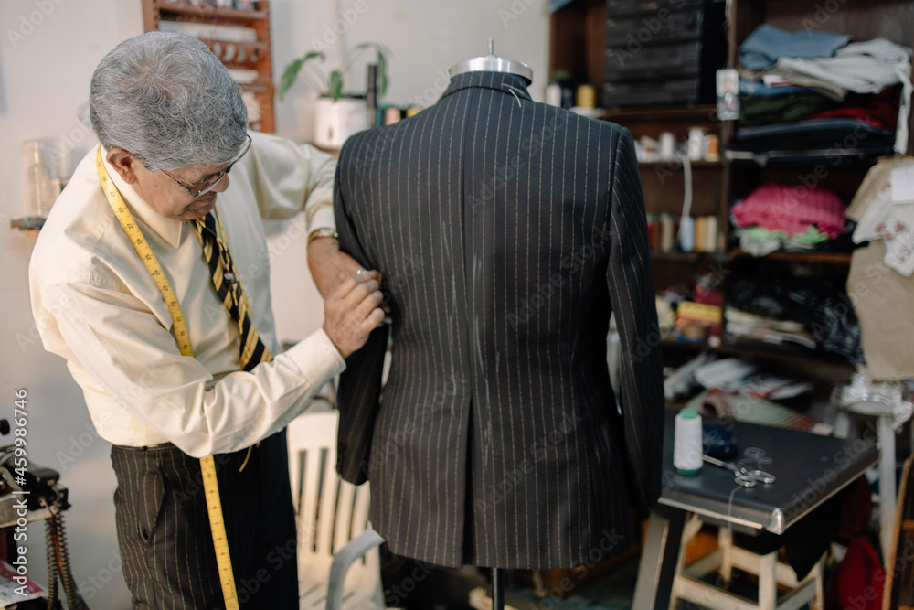 experienced mexican tailor working on local business