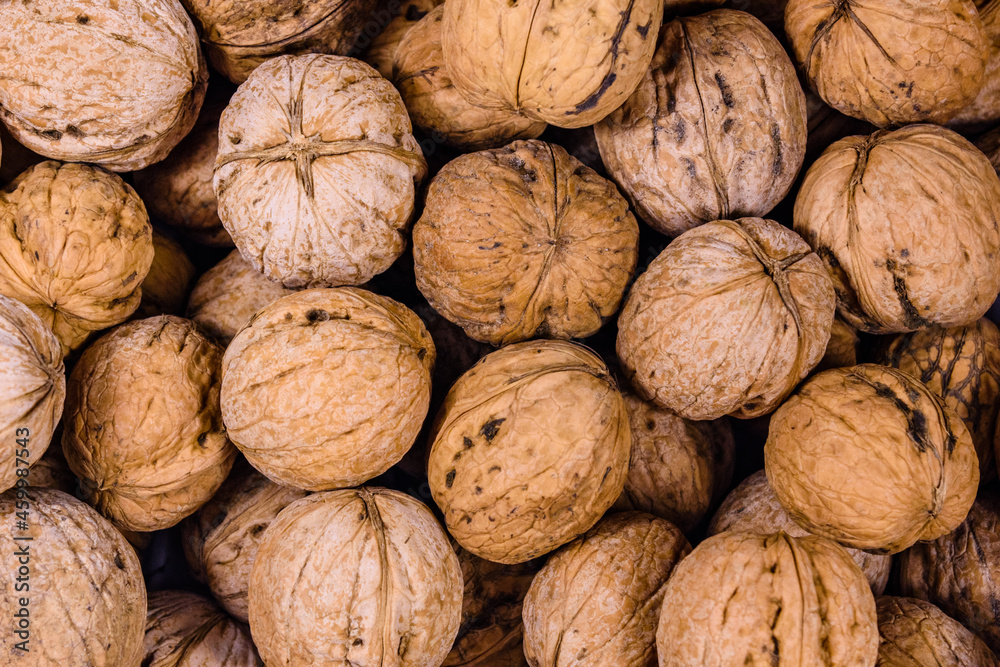 Heap of many walnuts for the background