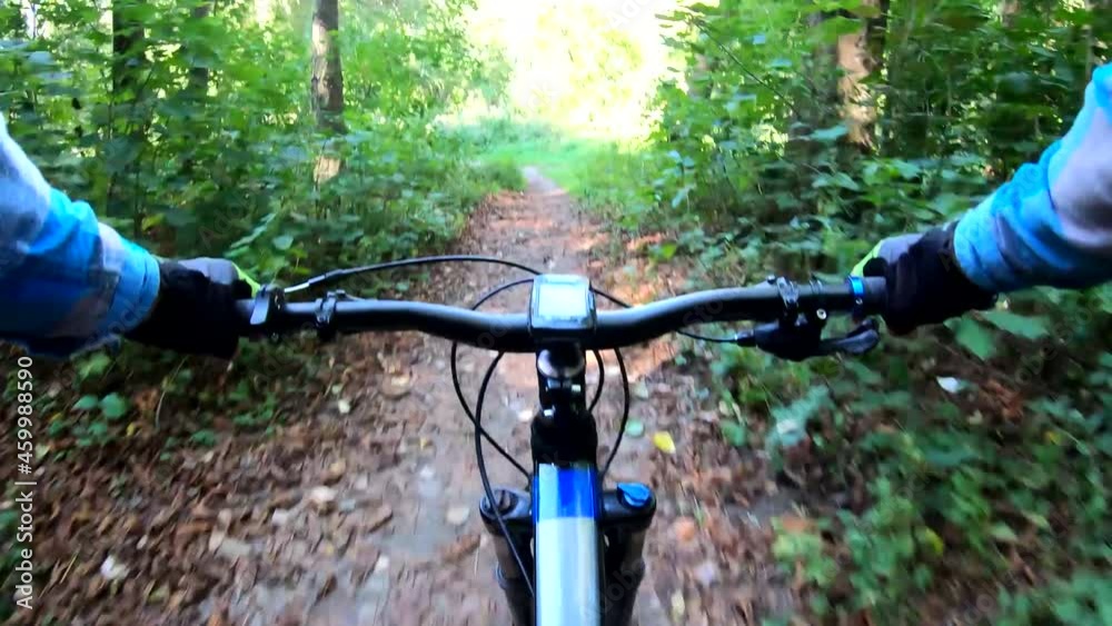 Amateur rider on the MTB bicycle on the trails in the autumn season Amateur rider on the MTB bicycle on the trails in the autumn season