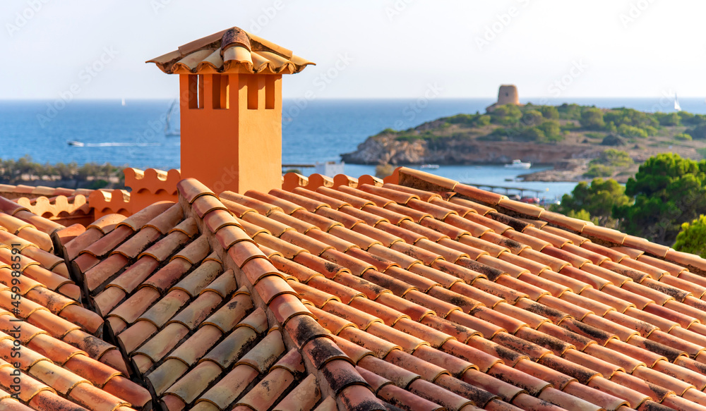 Tiled roofs of Palma de Mallorca. House by the sea 
