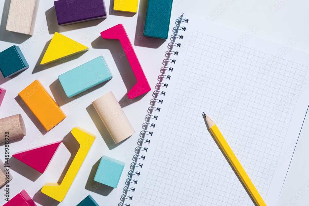 Geometric shapes and a blank notepad. Empty space for text. Geometric shapes and a blank notepad. Empty space for text.