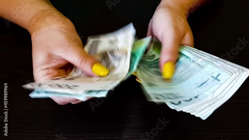 The woman counts the money. Close up of female hands count money cash. Money, Payment, Finance, Investment and Success, Concept. Currency exchange in banking institution
