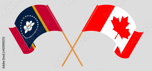 Crossed and waving flags of The State of Mississippi and Canada
