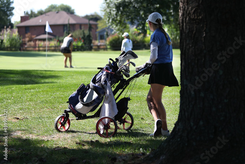 young girls participate in a golf tournament