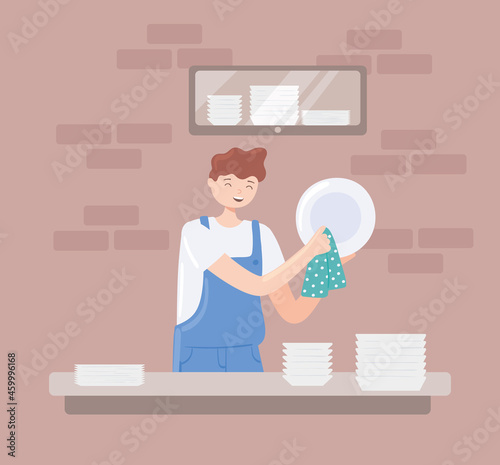 young man washing dishes