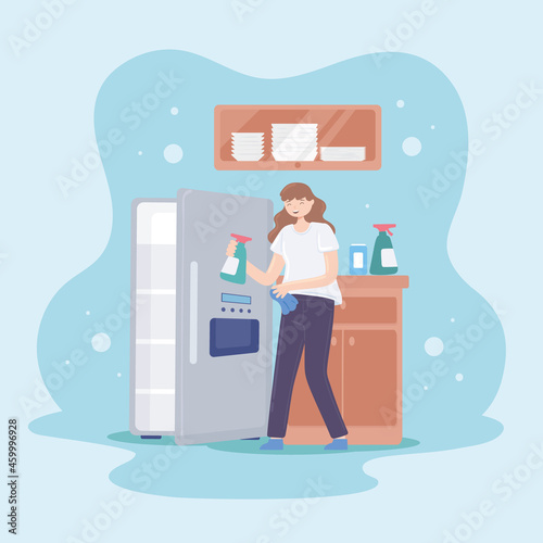 woman cleaning a fridge