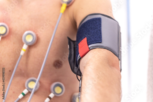 Close-up of blood pressure sleeve on a man while an exercise ECG photo