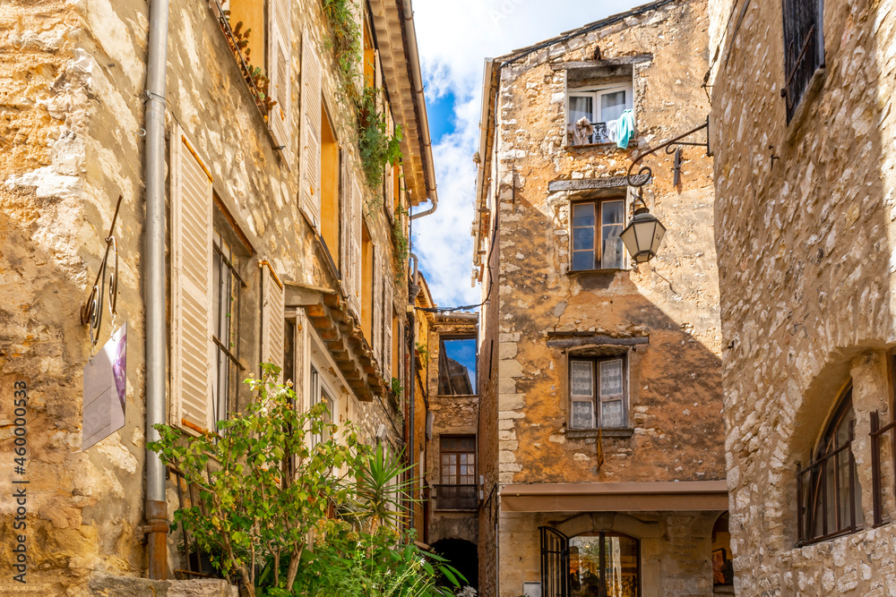 Fototapeta premium Picturesque stone medieval homes and apartments inside the walled village of Tourrettes-Sur-Loup in the Provence, Alpes-Maritimes region of southern France.