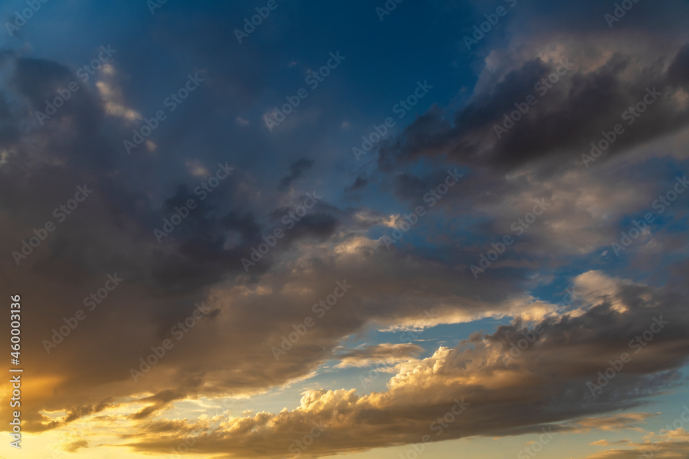 Beautiful bright sunset sky with clouds. Sky nature background.