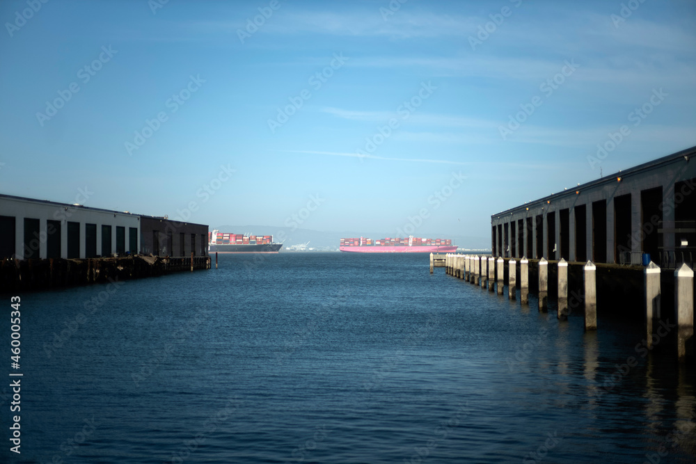 Fototapeta premium pier 40-42 at the bay with cargo boats in waiting in the San Francisco Bay, supply chain bottleneck