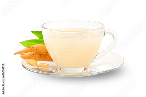 Finger root herbal tea in glass cup with slice and leaves isolated on white background.