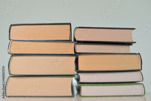 World Book Day.Reading and education . Two stacks of books on a light background.Books close-up.