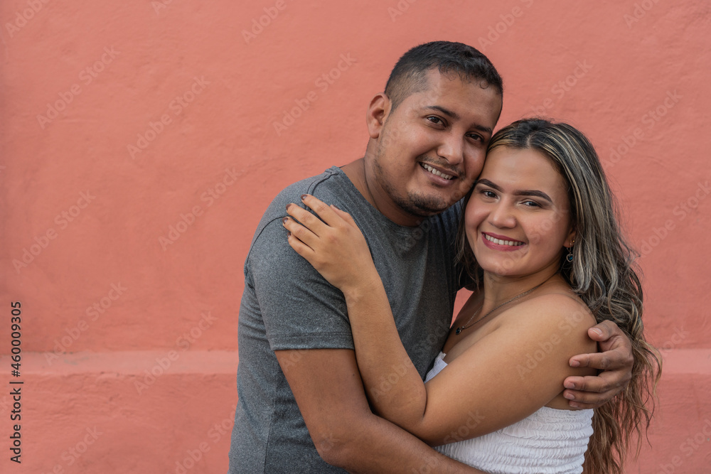 Hispanic couple on the street. Love, relationship, romantic concept.