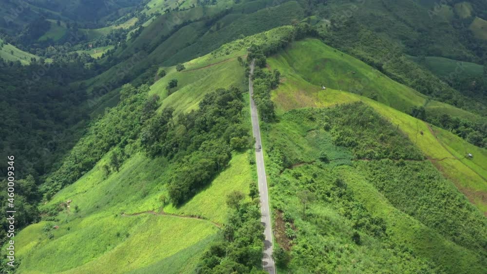 An aerial view of a beautiful road that passes on a mountain. rural areas of northern Thailand An aerial view of a beautiful road that passes on a mountain. rural areas of northern Thailand