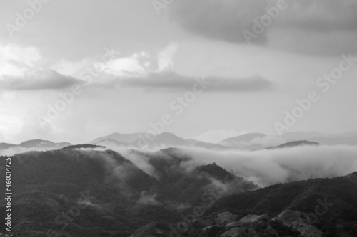 Dramatic black and white image of clouds over mountains in the Caribbean island of the Dominican Republic.