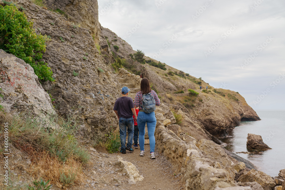 A family walks along a trail in Crimea