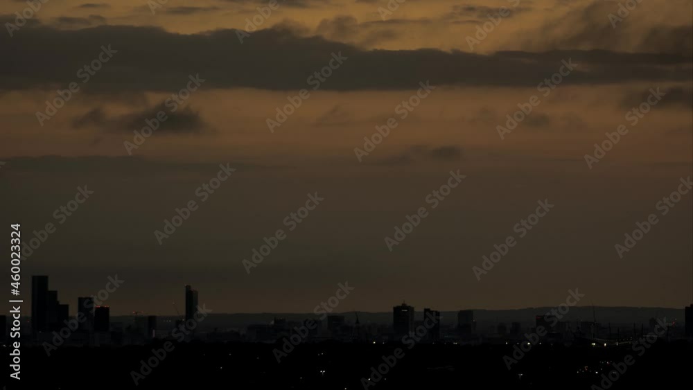 Sunset over manchester with a huge orange sun setting behind the CBD. Sunset over manchester with a huge orange sun setting behind the CBD.
