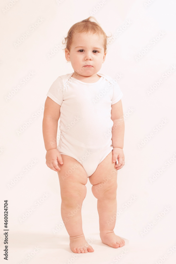 beautiful caucasian baby standing upright looking at camera beautiful caucasian baby standing upright looking at camera
